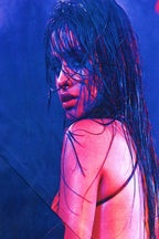 Camila Cabello poster features a close-up portrait with wet dark hair, vivid pink skin tones, and deep blue lighting.