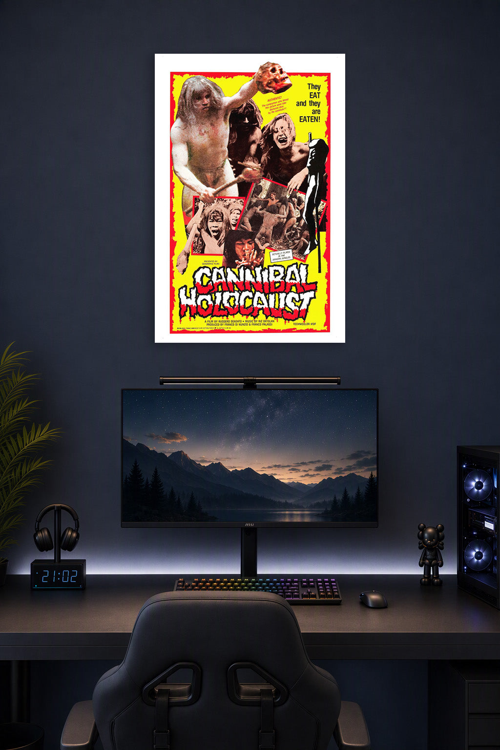 Cannibal Holocaust Movie Poster in a gaming desk setup above a monitor.