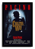 Framed Carlito's Way wall art print depicts Al Pacino's armed silhouette in a dark doorway beneath bold red and gold film text.