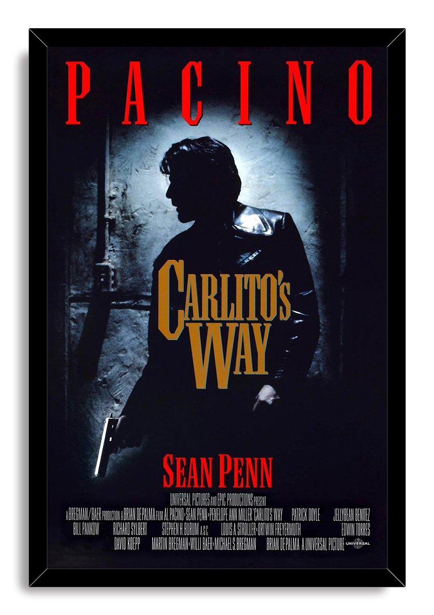 Framed Carlito's Way wall art print depicts Al Pacino's armed silhouette in a dark doorway beneath bold red and gold film text.