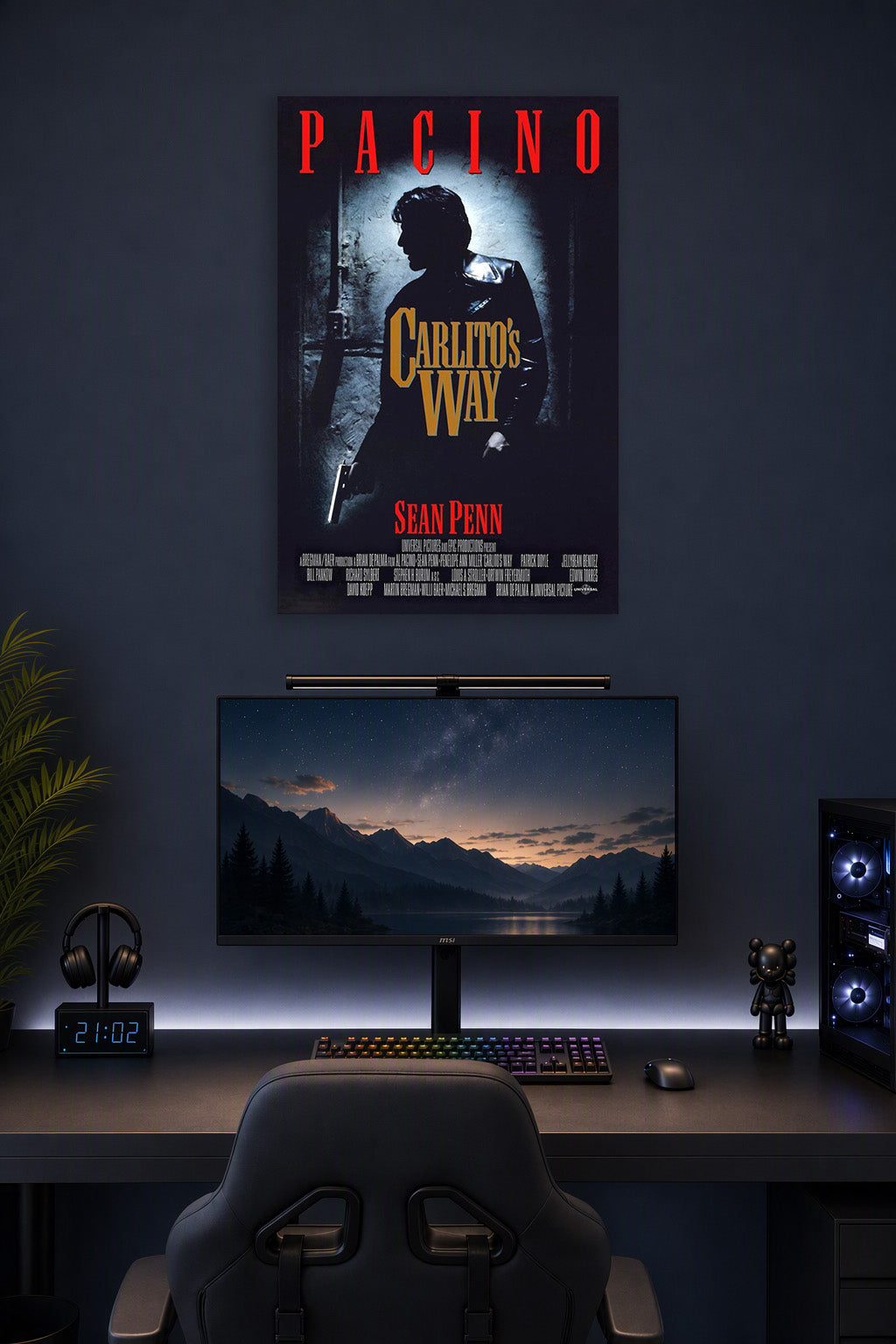 Carlito's Way Al Pacino in a gaming desk setup above a monitor.