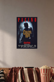 Carlito's Way Al Pacino in a cozy movie room above a brown sofa with popcorn.