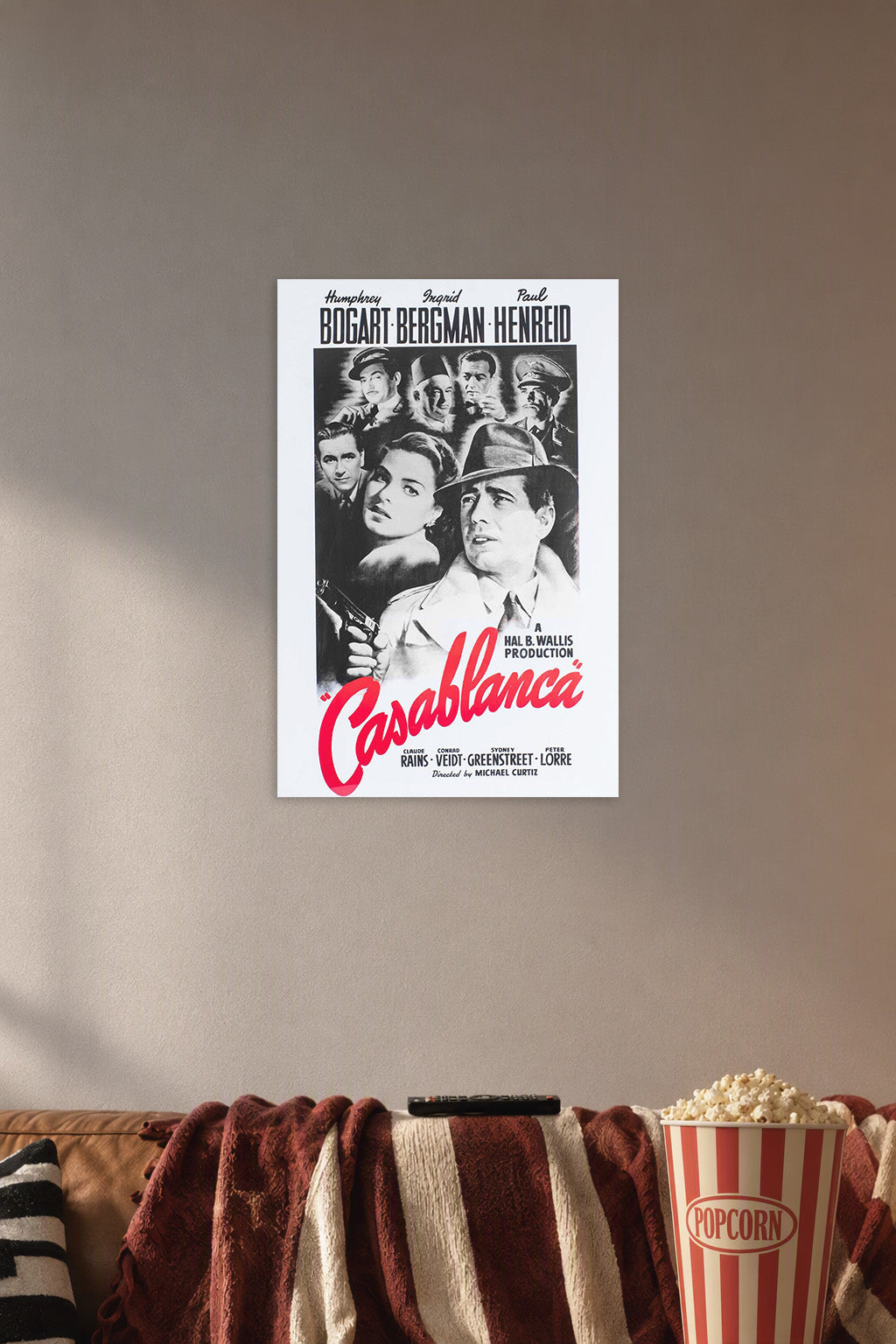 Casablanca Movie in a cozy movie room above a brown sofa with popcorn.
