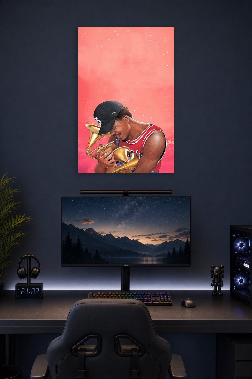 Chance the Rapper in a gaming desk setup above a monitor.