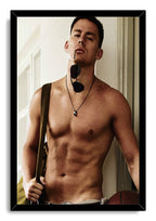 Channing Tatum framed wall art print presents a shirtless man holding sunglasses, set in a black frame against a white background.