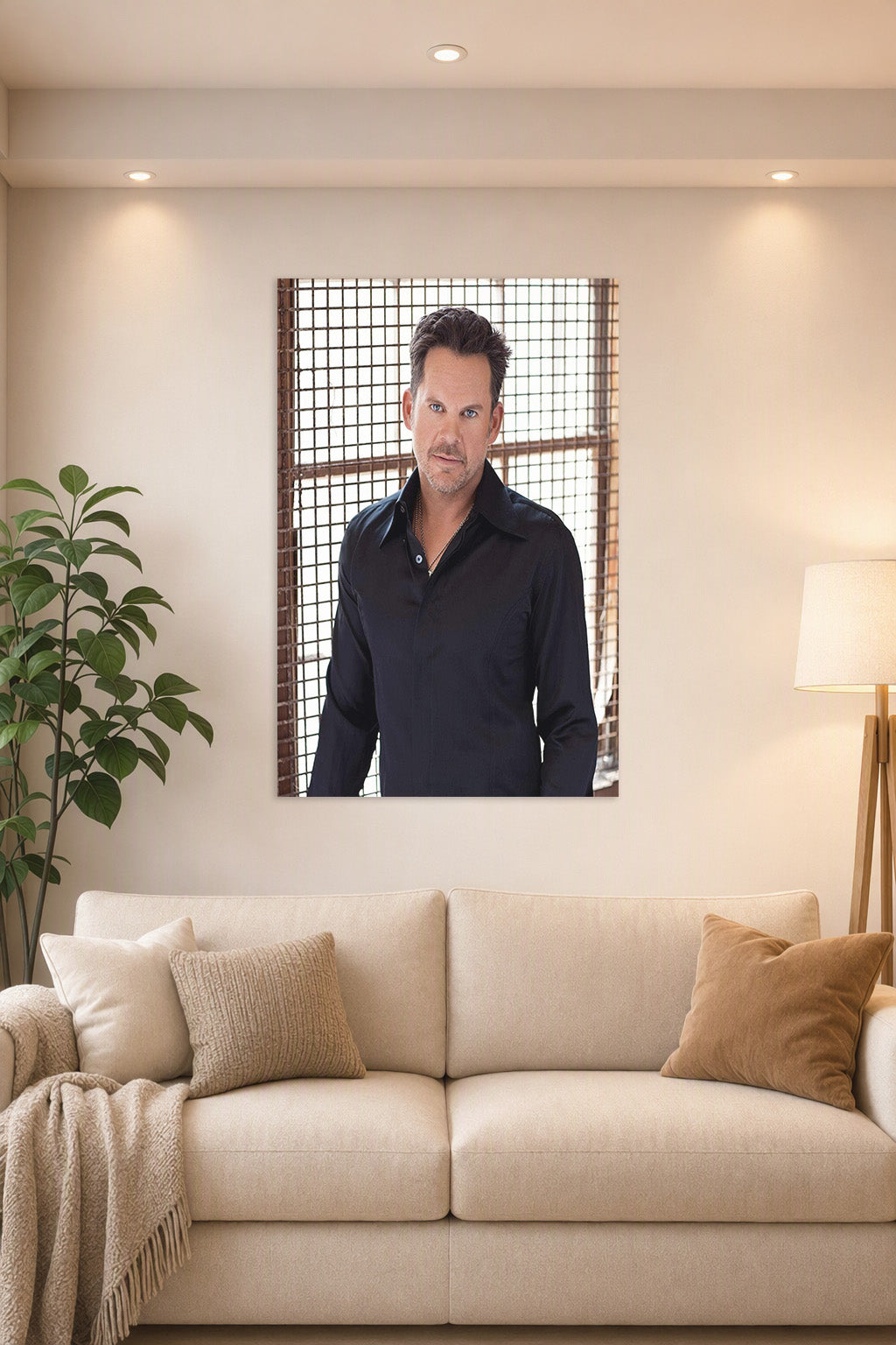 Charismatic Male Celebrity in a bright living room above a beige sofa.