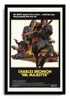 Framed Mr. Majestyk movie poster wall art print with Charles Bronson wielding a rifle over an illustrated action scene and bold yellow title.