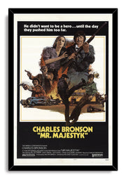 Framed Mr. Majestyk movie poster wall art print with Charles Bronson wielding a rifle over an illustrated action scene and bold yellow title.