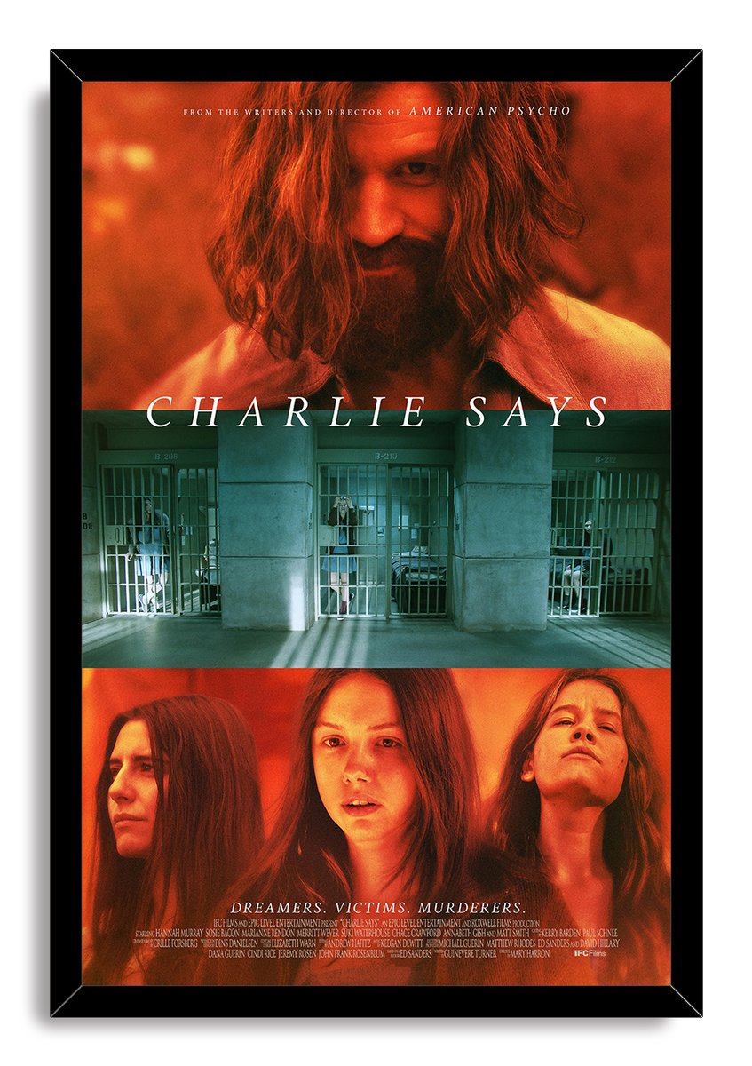 Charlie Says framed wall art print in a black frame, with red portraits, teal prison bars, and the film title.