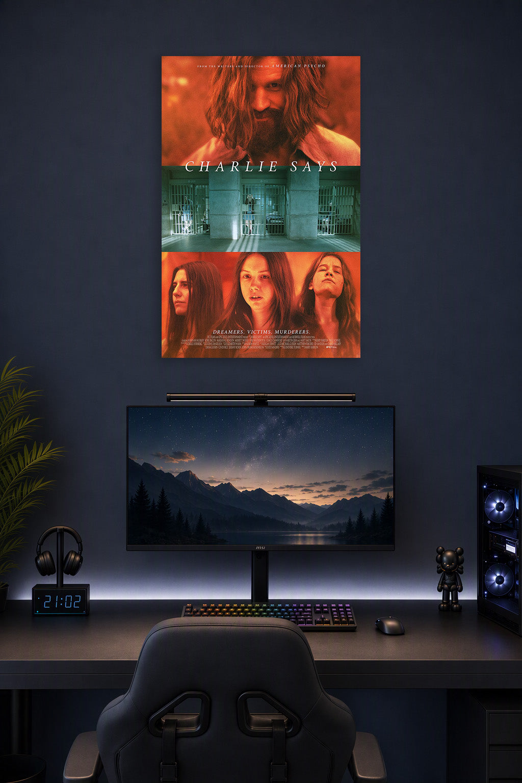 Charlie Says Movie in a gaming desk setup above a monitor.