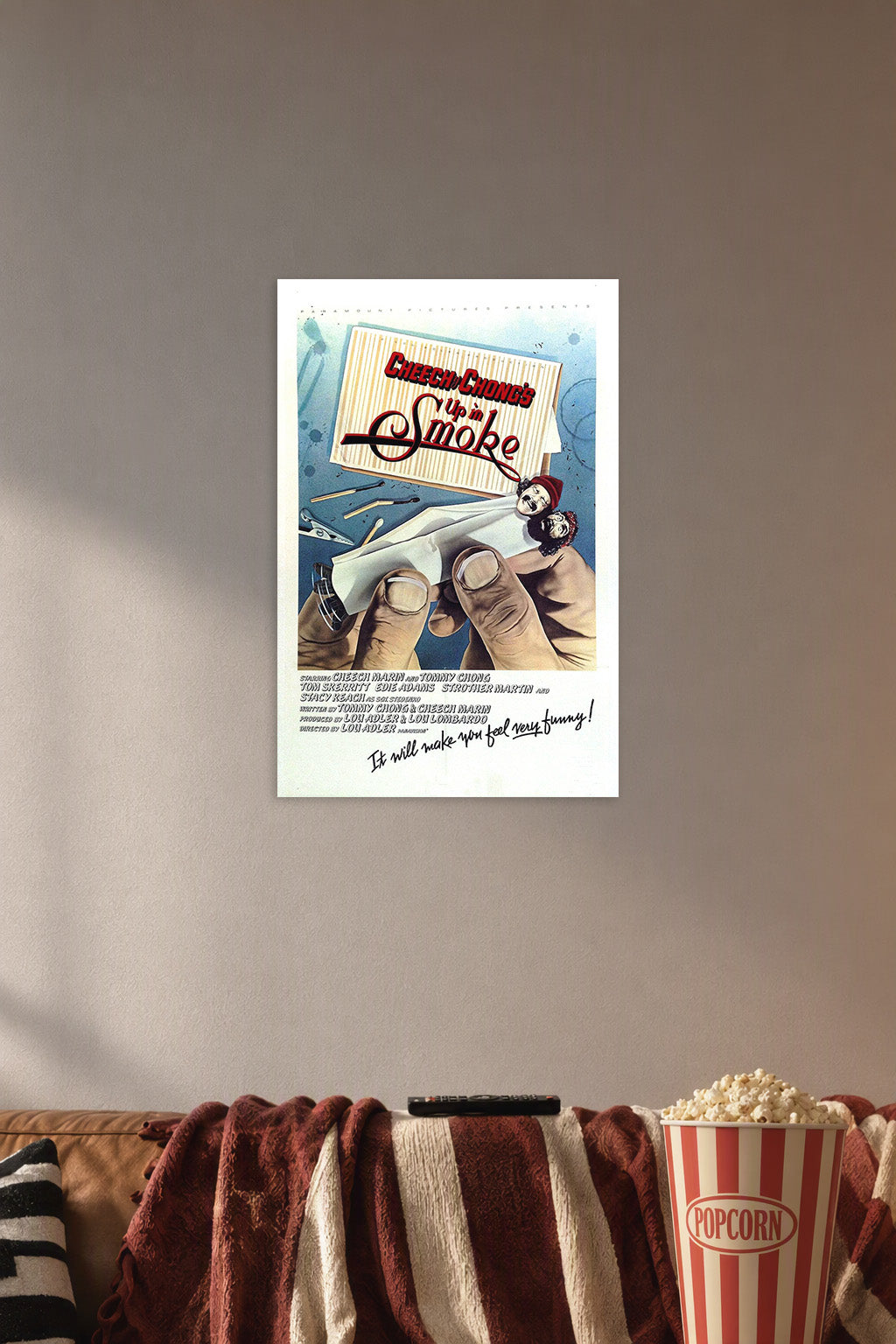 Cheech & Chong's Up in Smoke Movie Poster in a cozy movie room above a brown sofa with popcorn.
