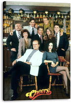 Cheers canvas wall art print featuring the cast gathered in the bar, with two seated figures and hanging glassware overhead.