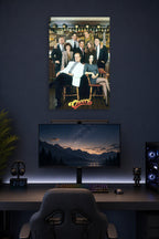Cheers TV Show Cast in a gaming desk setup above a monitor.