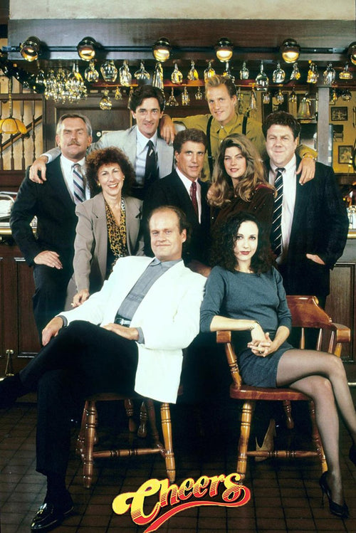 Cheers poster featuring nine cast members posed in a warmly lit bar beneath hanging glasses, with the yellow-red logo.