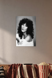 Cher in a cozy movie room above a brown sofa with popcorn.