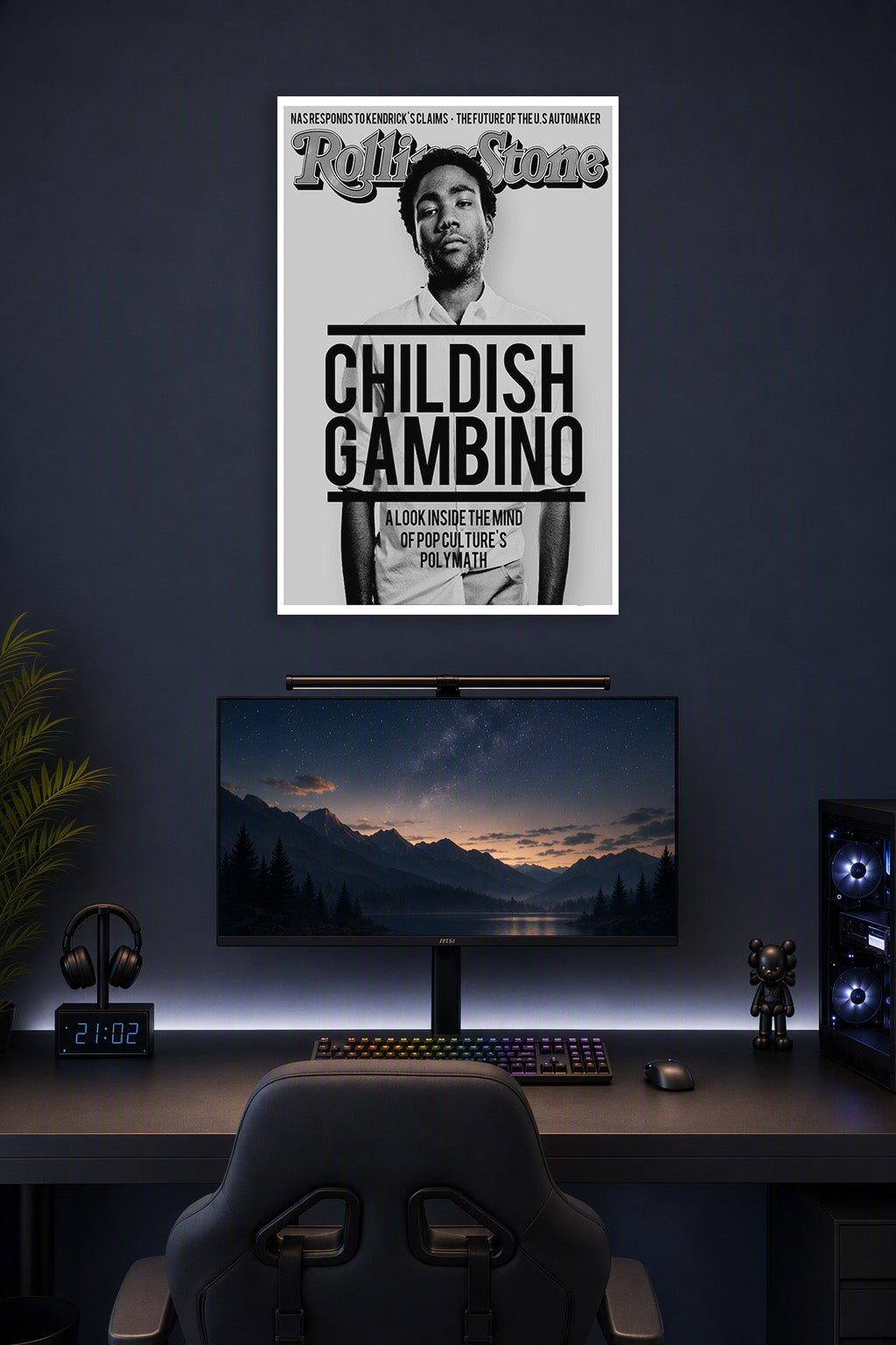 Childish Gambino in a gaming desk setup above a monitor.