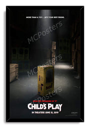 Child's Play framed wall art print presents the yellow Buddi toy box in a dim warehouse, bordered by a black frame.
