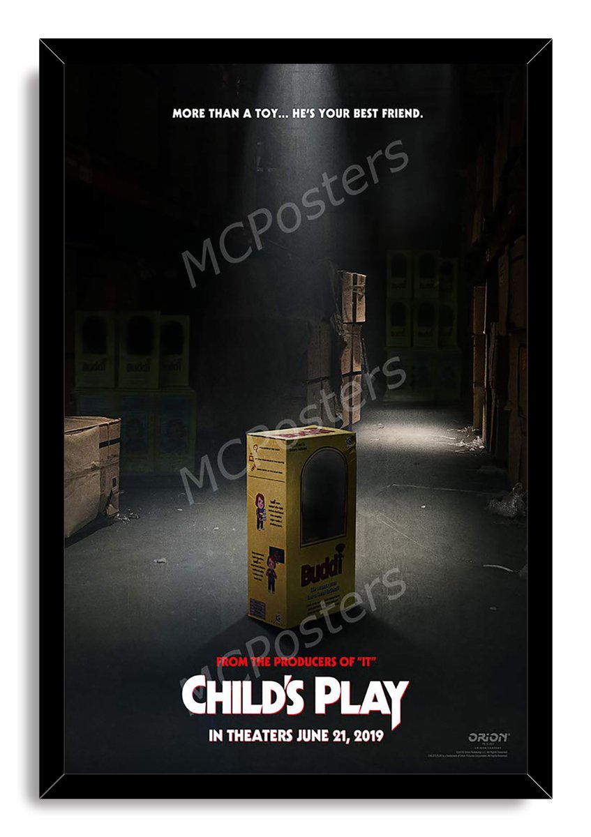Child's Play framed wall art print presents the yellow Buddi toy box in a dim warehouse, bordered by a black frame.