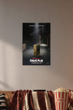 Child's Play Chucky Movie Poster in a cozy movie room above a brown sofa with popcorn.