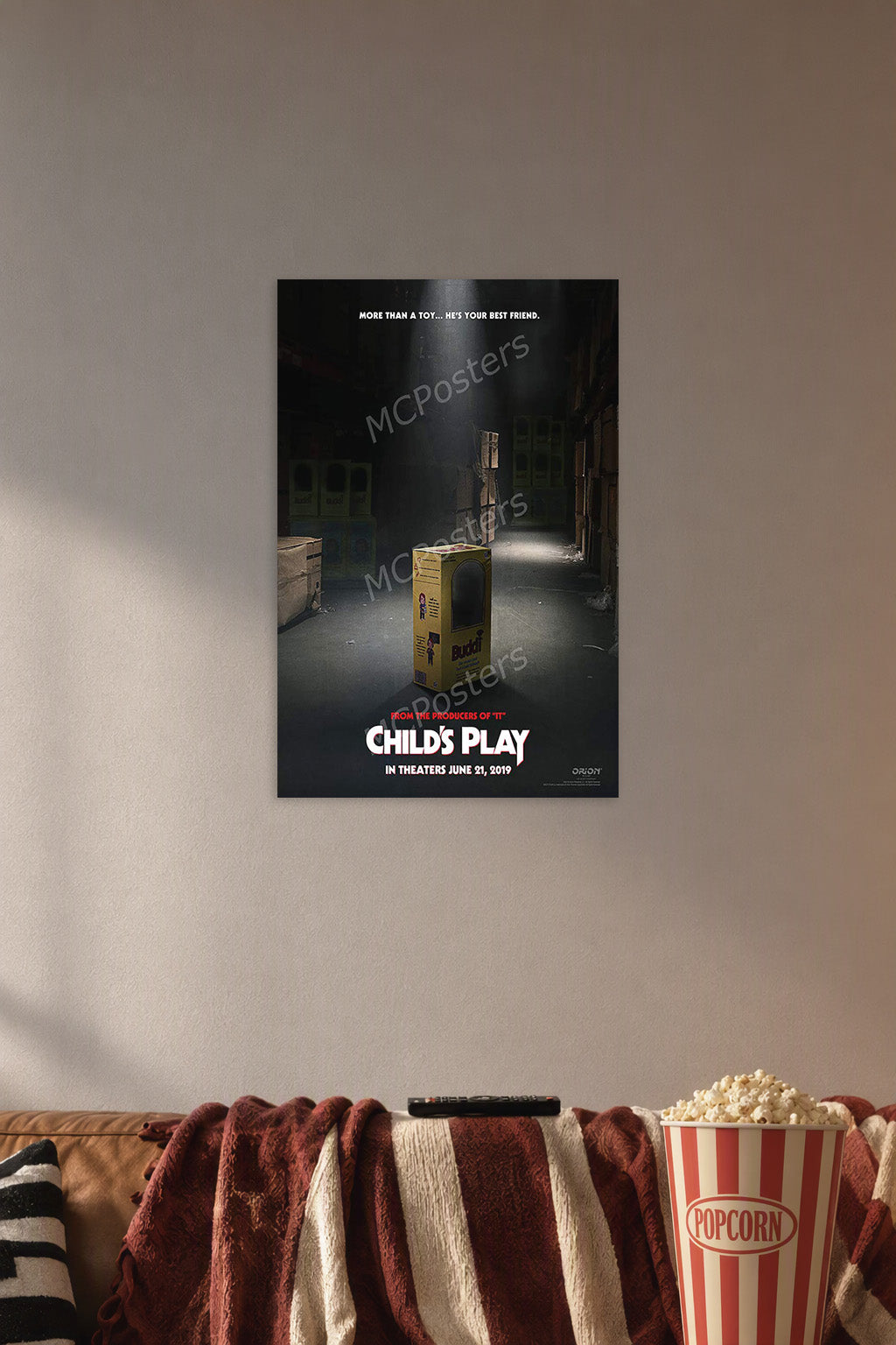 Child's Play Chucky Movie Poster in a cozy movie room above a brown sofa with popcorn.