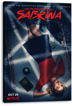 Chilling Adventures of Sabrina canvas wall art print displays Sabrina in red beside Salem, an 8-ball, and occult book.