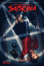 Chilling Adventures of Sabrina poster with Sabrina lying on a patterned rug beside a black cat, pentagram book, and 8-ball.