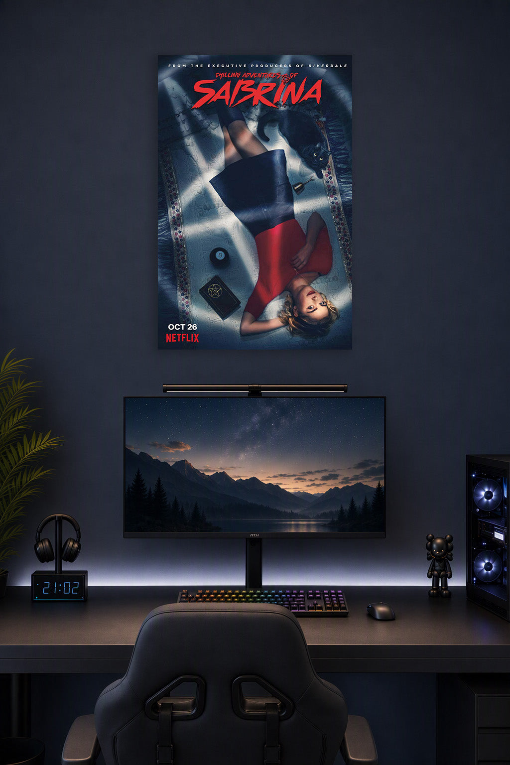 Chilling Adventures of Sabrina in a gaming desk setup above a monitor.