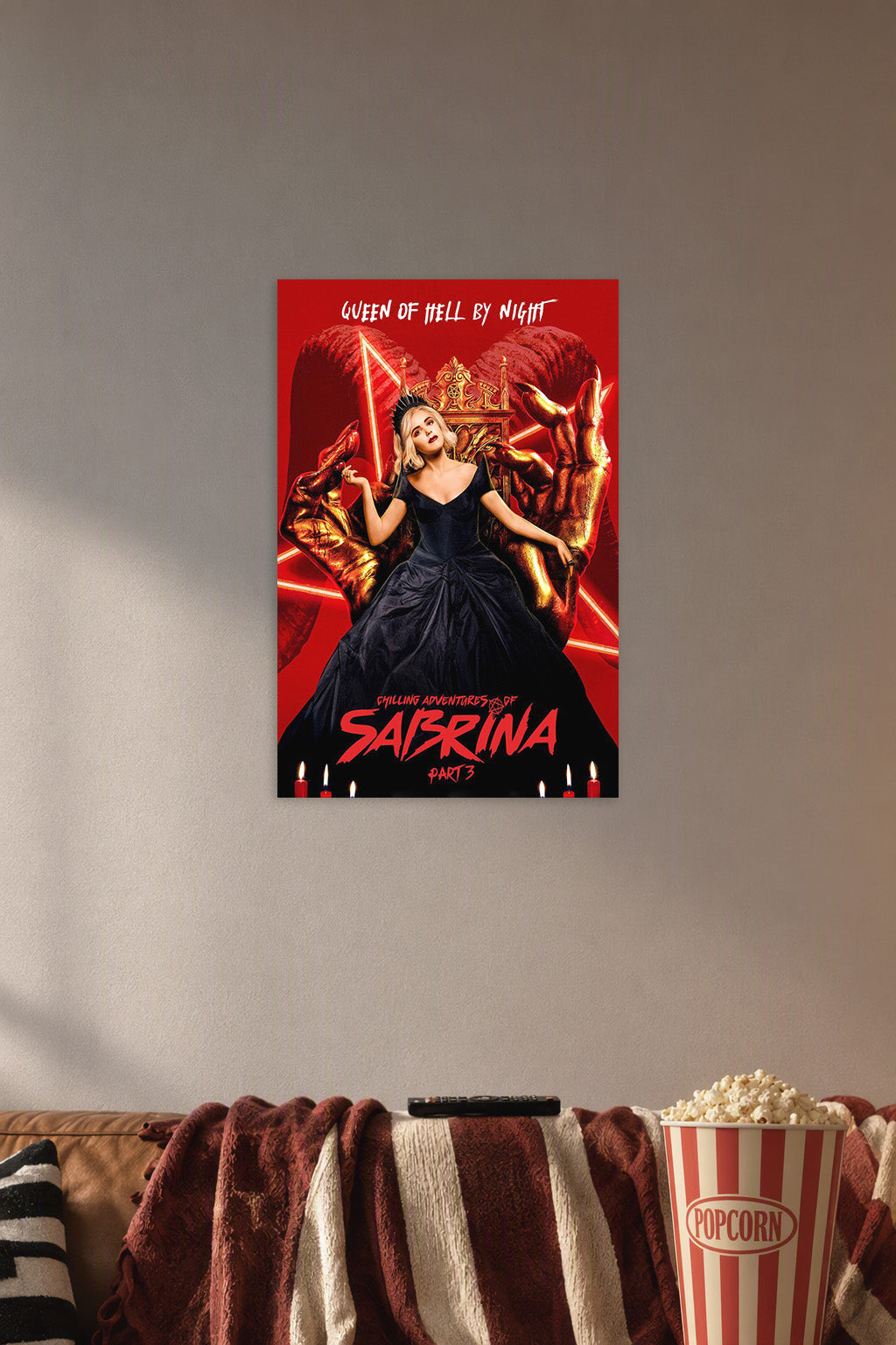 Chilling Adventures of Sabrina - Queen of Hell in a cozy movie room above a brown sofa with popcorn.