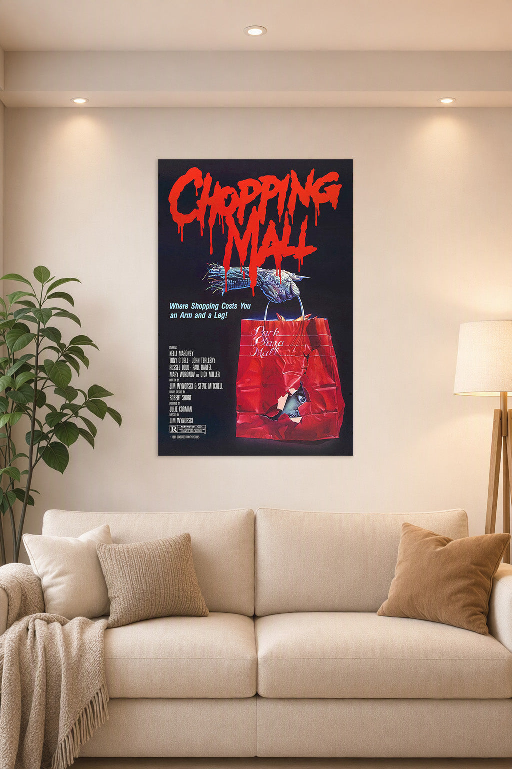 Chopping Mall Horror Movie Poster in a bright living room above a beige sofa.