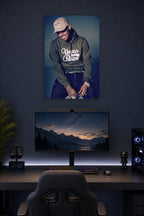 Chris Brown in a gaming desk setup above a monitor.