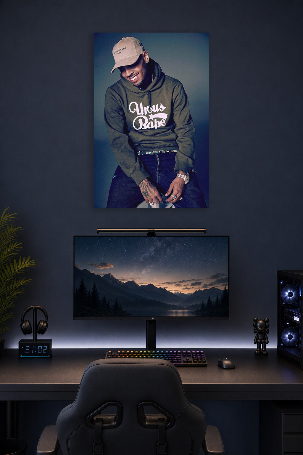 Chris Brown in a gaming desk setup above a monitor.