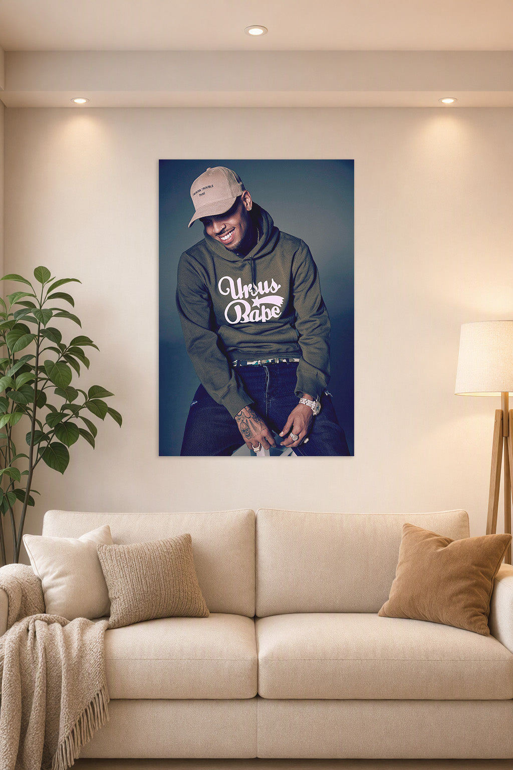 Chris Brown in a bright living room above a beige sofa.
