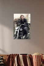 Chris Hemsworth in a cozy movie room above a brown sofa with popcorn.