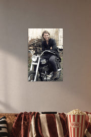 Chris Hemsworth in a cozy movie room above a brown sofa with popcorn.