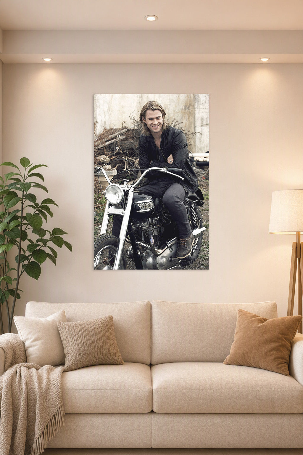 Chris Hemsworth in a bright living room above a beige sofa.