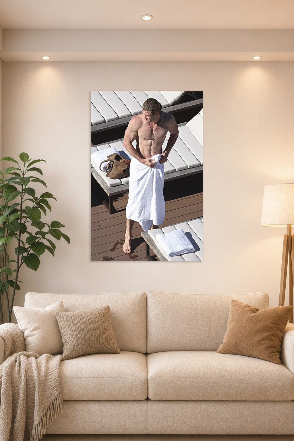 Chris Hemsworth in a bright living room above a beige sofa.