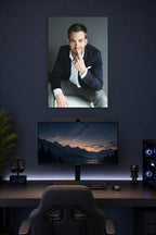 Chris Pine in a gaming desk setup above a monitor.