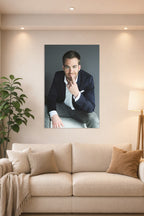 Chris Pine in a bright living room above a beige sofa.