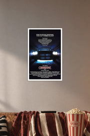 Christine (1983) Movie Poster in a cozy movie room above a brown sofa with popcorn.