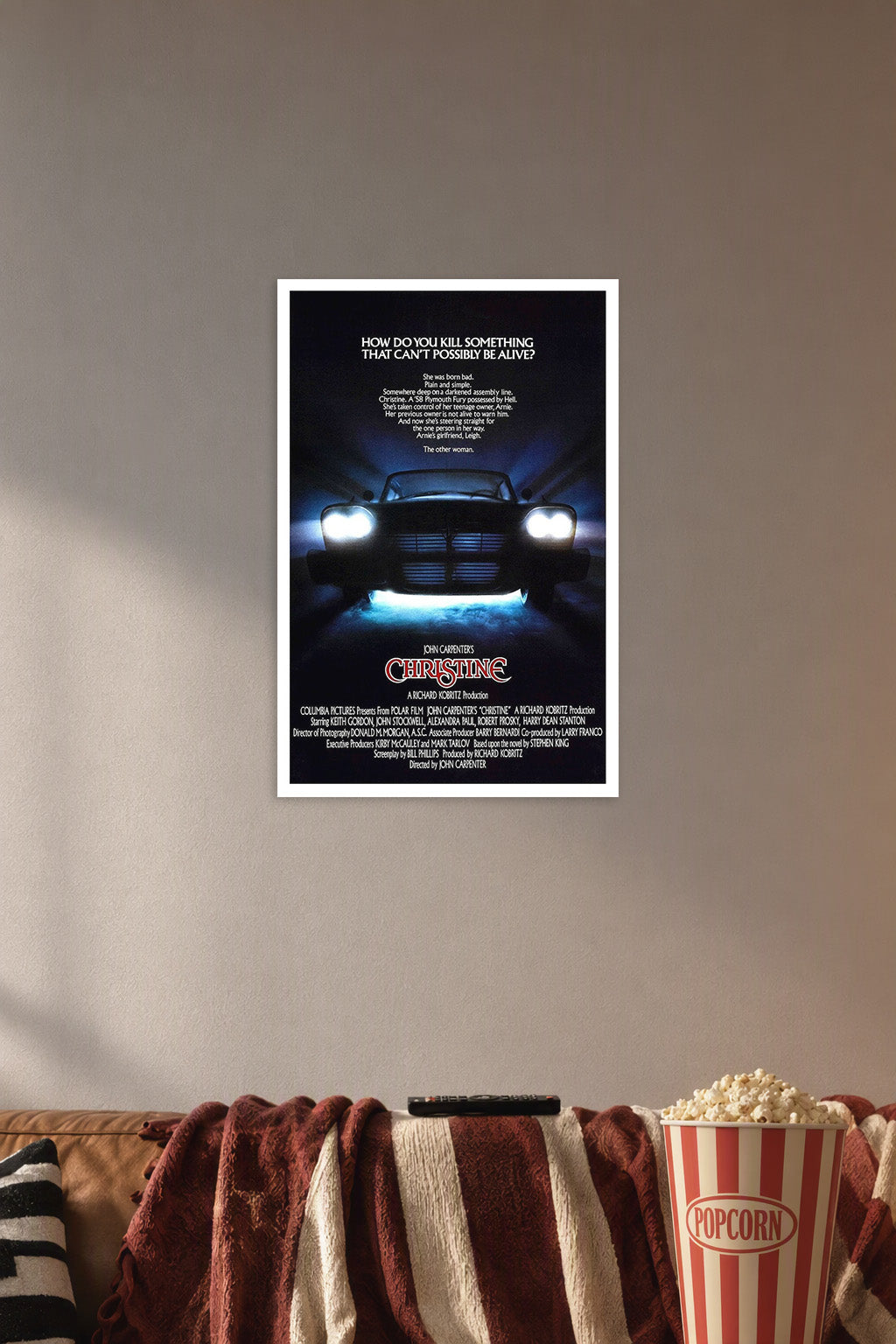 Christine (1983) Movie Poster in a cozy movie room above a brown sofa with popcorn.