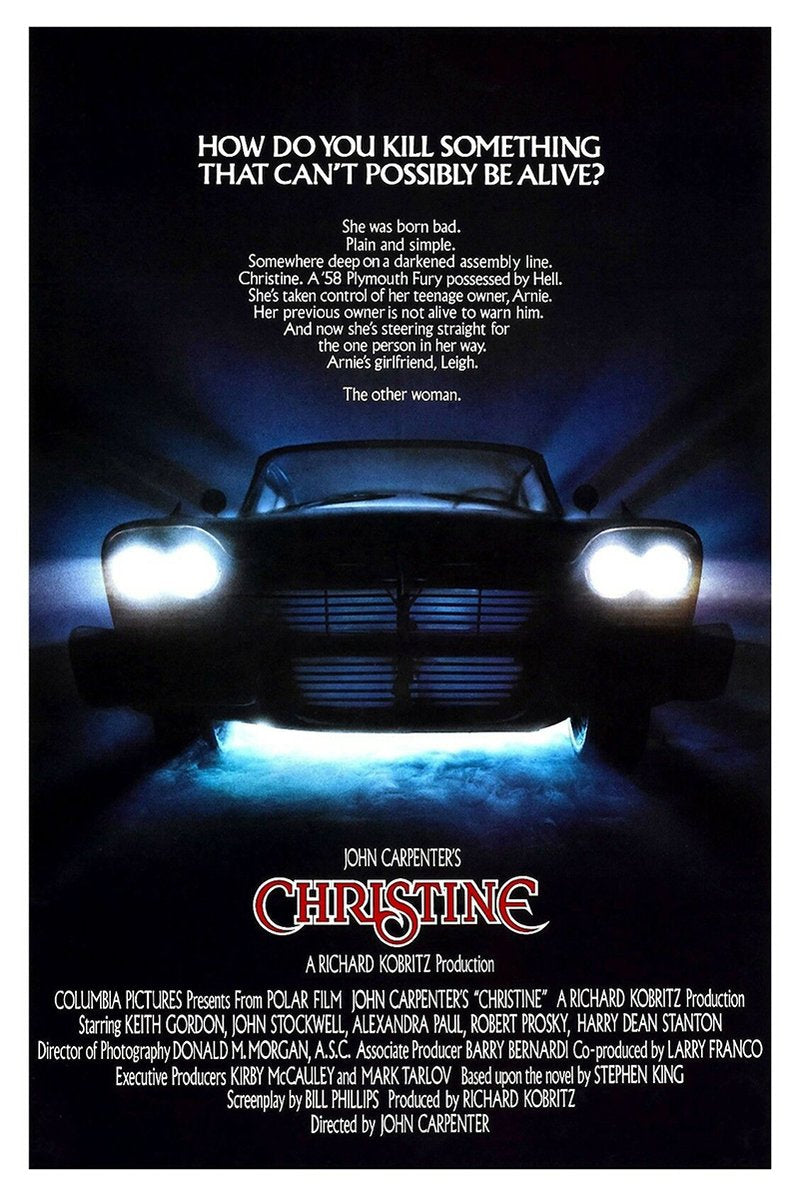 Christine movie poster wall art print features a black vintage car head-on with glowing headlights in blue mist.