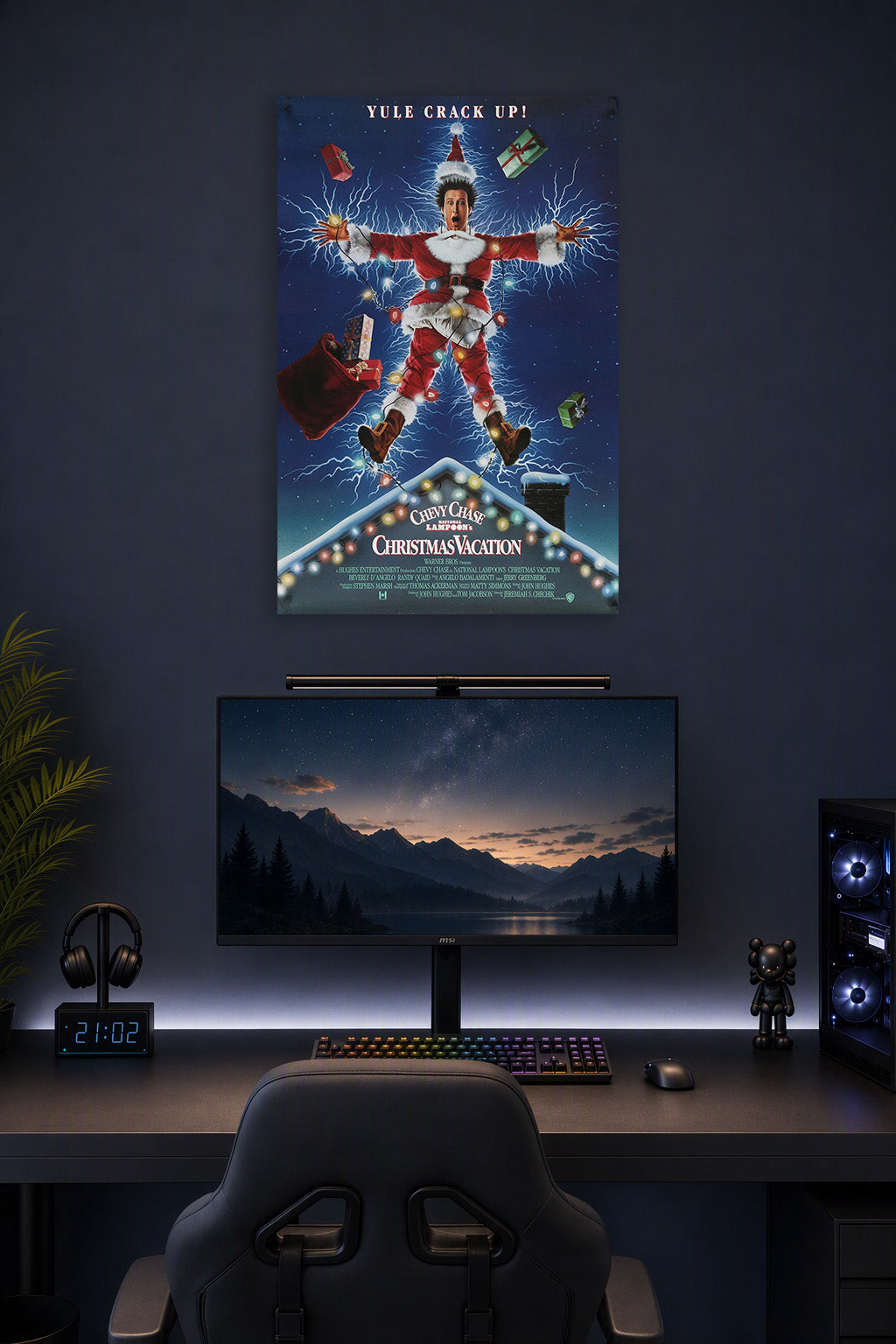 Clark Griswold Christmas Vacation in a gaming desk setup above a monitor.