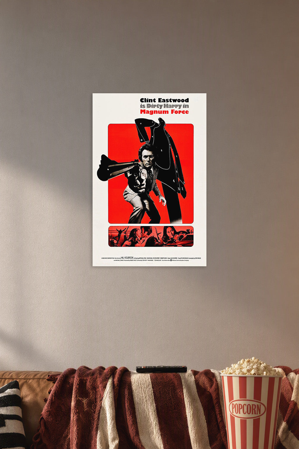 Clint Eastwood Dirty Harry Magnum Force in a cozy movie room above a brown sofa with popcorn.