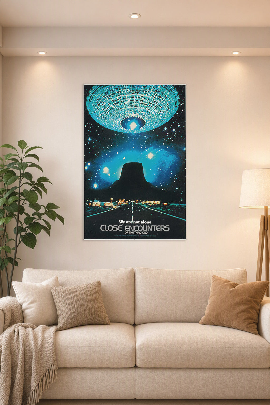 Close Encounters of the Third Kind in a bright living room above a beige sofa.