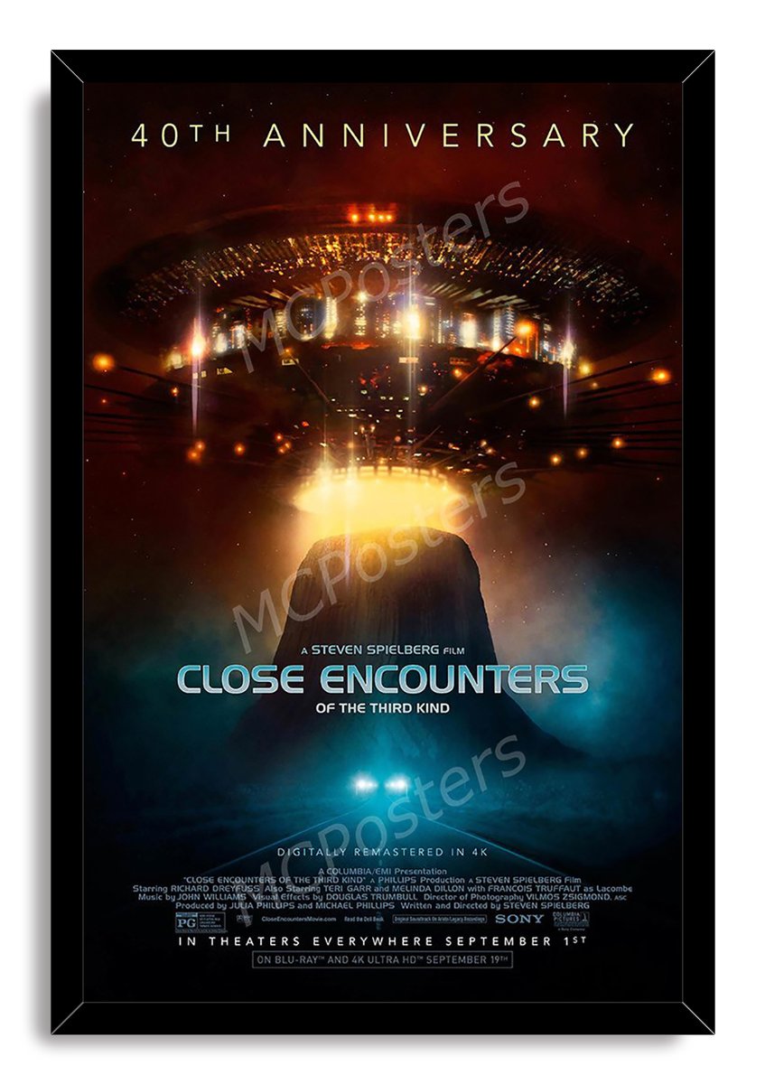 Close Encounters of the Third Kind framed wall art print features a bright alien craft, Devil's Tower, and blue mist.