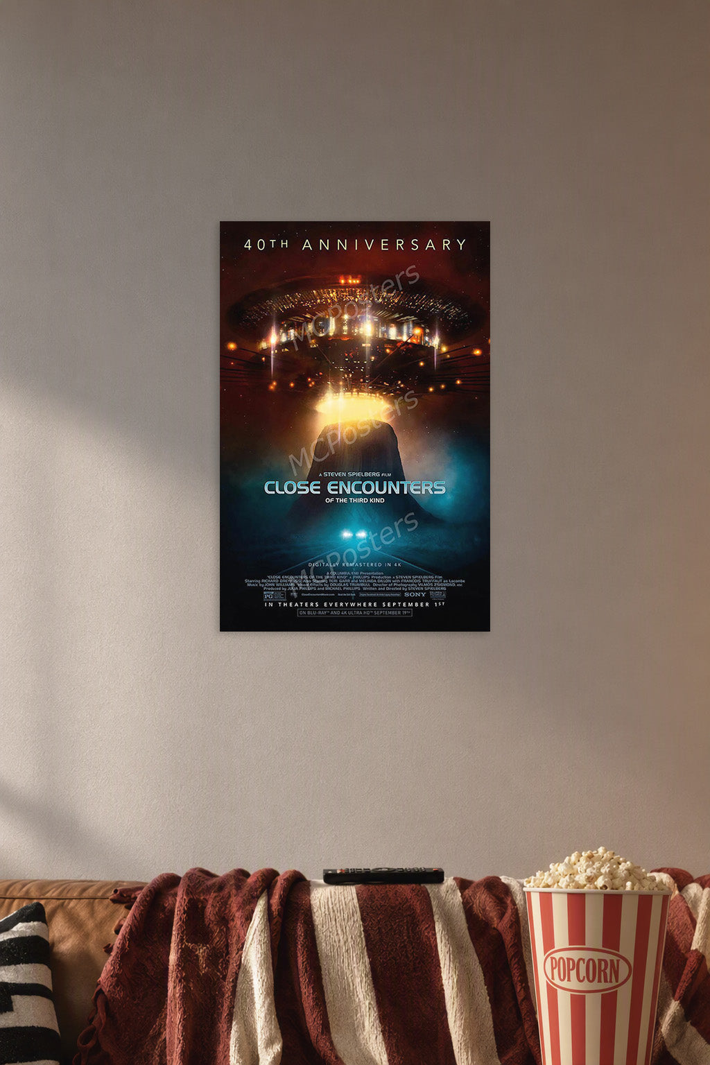 Close Encounters of the Third Kind Movie in a cozy movie room above a brown sofa with popcorn.