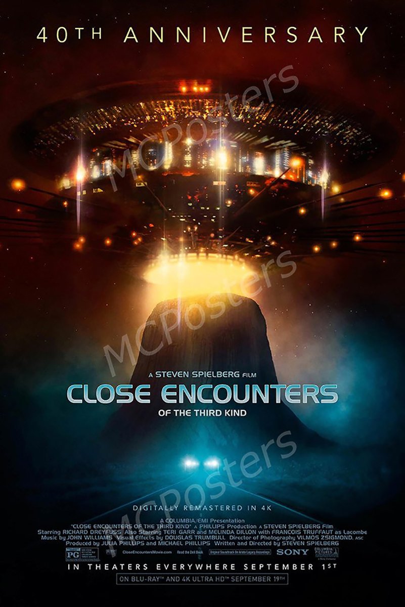 Close Encounters of the Third Kind poster features a glowing mothership above Devil's Tower beneath a dark red starry sky.