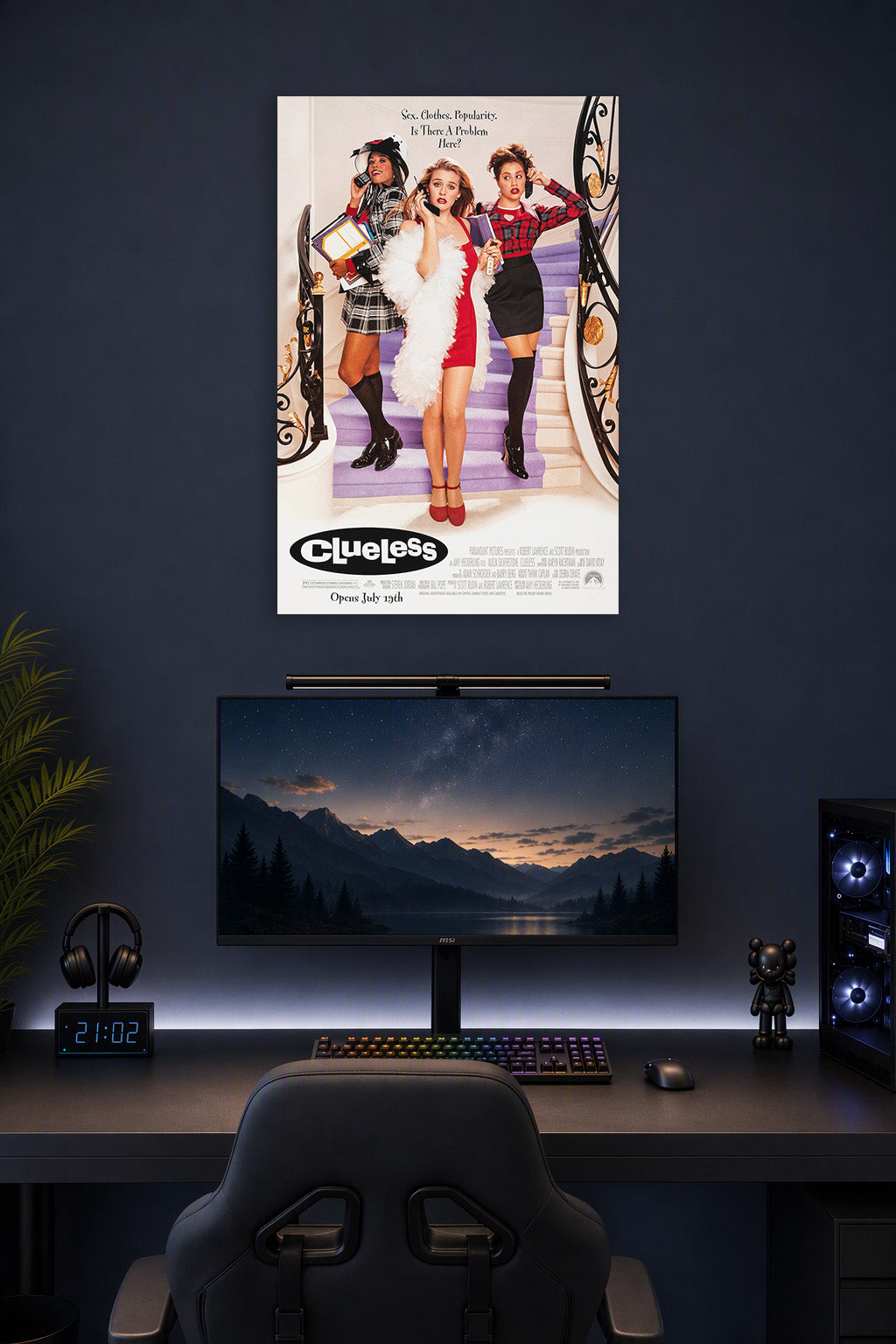 Clueless Movie Poster in a gaming desk setup above a monitor.