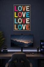 Colorful LOVE Text in a gaming desk setup above a monitor.