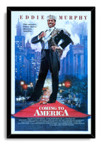 Coming to America framed wall art print featuring Eddie Murphy as Prince Akeem, standing over a red carpet amid a blue city skyline.